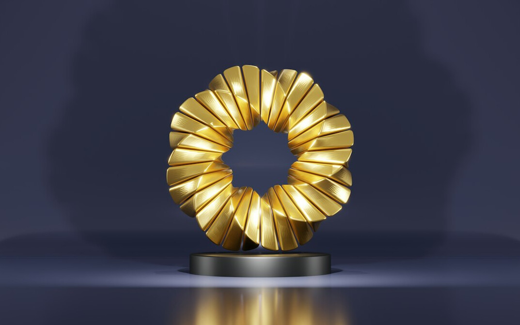 Golden award trophy on stage with lights
