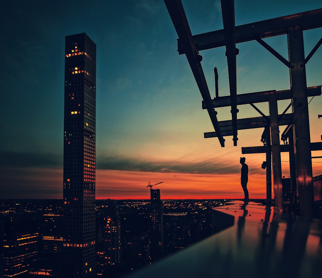 Rooftop party at sunset with city skyline