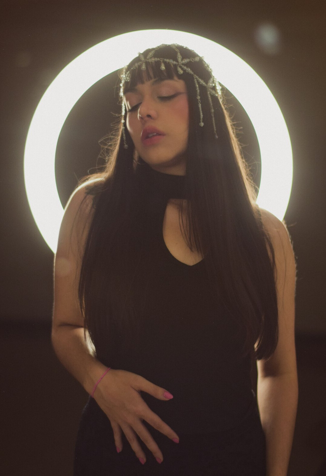 Young content creator filming with ring light